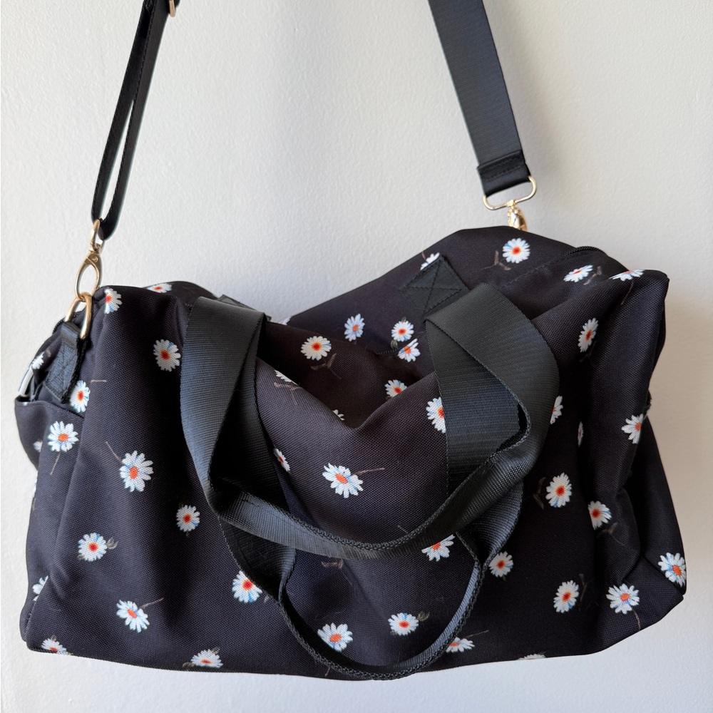 Alice + Olivia black duffel tote in daisy on black